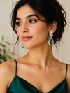 Moissanite and emerald earrings